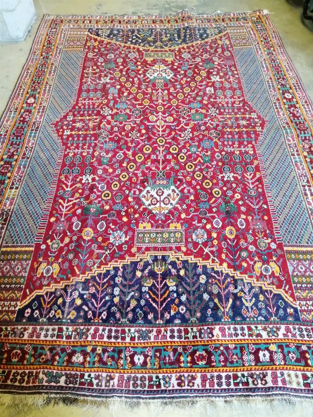 A North West Persian red ground carpet, 300 x 200cm